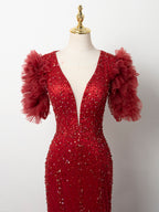 Luxury Burgundy Formal Gown - Voluminous Ruffled Train & Deep V-Beaded Silhouette